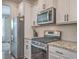 Well-equipped kitchen with stainless steel appliances, white cabinets, and granite countertops at 131 Summer Tanager Dr, Ravenel, SC 29470