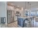 Stylish kitchen with stainless steel appliances, granite countertops, and a view to the living room at 131 Summer Tanager Dr, Ravenel, SC 29470