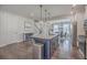 Well-lit kitchen features a large center island with granite countertops and stainless steel appliances at 131 Summer Tanager Dr, Ravenel, SC 29470