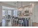 Open kitchen and dining room with a large center island and stainless appliances at 131 Summer Tanager Dr, Ravenel, SC 29470