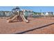 Community playground with multiple slides and climbing structures surrounded by wood chip ground cover at 131 Summer Tanager Dr, Ravenel, SC 29470