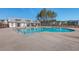 Outdoor pool and clubhouse area surrounded by trees and well-maintained landscaping at 131 Summer Tanager Dr, Ravenel, SC 29470