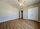 Bedroom with ceiling fan, closet, and light vinyl wood flooring at 1403 Cambridge Lakes Dr # 101, Mount Pleasant, SC 29464