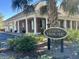 Community Clubhouse with a brick facade, pillars and lush landscaping at 1403 Cambridge Lakes Dr # 101, Mount Pleasant, SC 29464