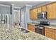 Kitchen featuring granite countertops, stainless steel appliances and light wood cabinets at 141 Beacon Falls Ct, Summerville, SC 29486