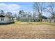 Large backyard features a detached storage shed, lawn and mature trees at 141 Cannon Ave, Goose Creek, SC 29445