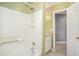 Bright bathroom featuring a tiled shower-tub combo, vanity with granite counters and neutral tile floors at 141 Cannon Ave, Goose Creek, SC 29445