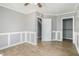 Light gray bedroom with trim features wood-look floors and closet with white doors at 141 Cannon Ave, Goose Creek, SC 29445