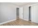 Neutral bedroom features wood-look floors, base trim, and a closet with sliding doors at 141 Cannon Ave, Goose Creek, SC 29445