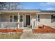 Close-up of cozy front porch with white railing and decorative stone edging at 141 Cannon Ave, Goose Creek, SC 29445