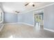 Bright and airy living room with wood-look floors and a large window at 141 Cannon Ave, Goose Creek, SC 29445