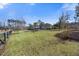 Expansive backyard featuring manicured lawn and fenced pool area at 144 Clark Ln, Summerville, SC 29483