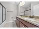 Bathroom featuring granite countertops, dual sinks, and a glass-enclosed shower at 144 Clark Ln, Summerville, SC 29483