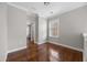 Well-lit bedroom featuring hardwood floors, neutral walls, and a bright window at 144 Clark Ln, Summerville, SC 29483