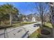 Long paved driveway lined with trees, creating a picturesque approach to the inviting home at 144 Clark Ln, Summerville, SC 29483