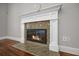 Close-up of a cozy fireplace with decorative mantel and stone surround at 144 Clark Ln, Summerville, SC 29483