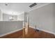 Upstairs hallway featuring hardwood floors and view of hanging light fixture at 144 Clark Ln, Summerville, SC 29483
