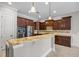Well-lit kitchen featuring granite countertops, stainless steel appliances, and custom cabinetry at 144 Clark Ln, Summerville, SC 29483