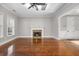 Inviting living room with fireplace, large windows, and gleaming hardwood floors at 144 Clark Ln, Summerville, SC 29483