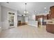Open living space featuring tile flooring and a view to the fireplace and kitchen at 144 Clark Ln, Summerville, SC 29483