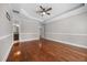 Hardwood floors highlight the main bedroom with a trey ceiling and ceiling fan at 144 Clark Ln, Summerville, SC 29483