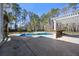 Backyard pool area with concrete patio and an outdoor bar, perfect for entertaining at 144 Clark Ln, Summerville, SC 29483