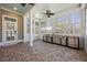 Enclosed sunroom featuring brick flooring, stainless steel appliances, and bright natural light at 144 Clark Ln, Summerville, SC 29483