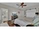 Well-lit bedroom featuring a ceiling fan, TV, and a convenient ensuite bathroom with a glass shower at 1523 Star Flower Aly, Johns Island, SC 29455