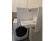 A laundry room with a dryer and a pull-out folding table inside a white cabinet at 1523 Star Flower Aly, Johns Island, SC 29455