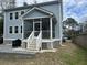 Exterior of the house with a screened in back porch and a beautiful patio area at 1601 Secessionville Rd, Charleston, SC 29412