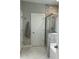 Bright bathroom with a glass-enclosed shower and gray stone tiling at 1601 Secessionville Rd, Charleston, SC 29412