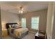 Comfortable bedroom with two windows and a ceiling fan at 1601 Secessionville Rd, Charleston, SC 29412