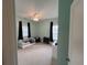 Bedroom featuring light blue walls, carpet, ceiling fan, curtains, and a daybed with car-themed bedding at 1601 Secessionville Rd, Charleston, SC 29412