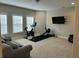 Large bonus room with home gym equipment and a comfortable seating area at 1601 Secessionville Rd, Charleston, SC 29412