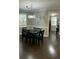 Elegant dining room with modern chandelier and herringbone pattern hardwood flooring at 1601 Secessionville Rd, Charleston, SC 29412