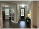 Elegant entryway with hardwood floors and a view into the office through french doors at 1601 Secessionville Rd, Charleston, SC 29412