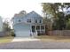 Charming two-story home with a welcoming front porch and a well-manicured lawn at 1601 Secessionville Rd, Charleston, SC 29412