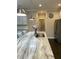 Close up of island with stone counters, stainless refrigerator in background at 1601 Secessionville Rd, Charleston, SC 29412