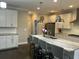 Spacious kitchen island with seating, granite countertops, and pendant lighting at 1601 Secessionville Rd, Charleston, SC 29412