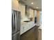 Modern kitchen featuring stainless appliances, granite counters, and white cabinetry at 1601 Secessionville Rd, Charleston, SC 29412