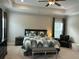 Comfortable main bedroom featuring a ceiling fan, sitting area, and windows at 1601 Secessionville Rd, Charleston, SC 29412
