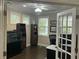 Bright office space with a ceiling fan, multiple windows, and built-in bookshelves at 1601 Secessionville Rd, Charleston, SC 29412