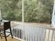 Screened-in porch with bar height chair featuring views of the backyard and privacy fence at 1601 Secessionville Rd, Charleston, SC 29412