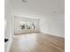 Bright room with hardwood floors, white trim, and large window at 1738 Cultivation Ln # 532, Mount Pleasant, SC 29466