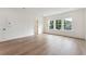 Bright room with hardwood floors, white trim, large window and a closet at 1738 Cultivation Ln # 532, Mount Pleasant, SC 29466