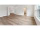 Spacious bedroom with hardwood floors, neutral walls, and ensuite bathroom at 1738 Cultivation Ln # 532, Mount Pleasant, SC 29466
