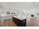 Modern kitchen featuring white cabinetry, stainless steel appliances, and a large center island with barstool seating at 1738 Cultivation Ln # 532, Mount Pleasant, SC 29466