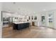 Modern kitchen featuring a large island, stainless steel appliances, and access to outdoor space at 1738 Cultivation Ln # 532, Mount Pleasant, SC 29466