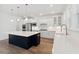 Bright kitchen boasts a large island, stainless steel appliances, and white cabinets at 1738 Cultivation Ln # 532, Mount Pleasant, SC 29466