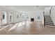 Bright living room featuring hardwood floors, a fireplace, and access to outdoor space at 1738 Cultivation Ln # 532, Mount Pleasant, SC 29466